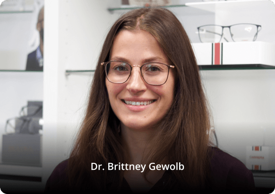 Portrait of Lackawanna eye doctor Dr. Brittney Gewolb wearing glasses in an optical center setting.