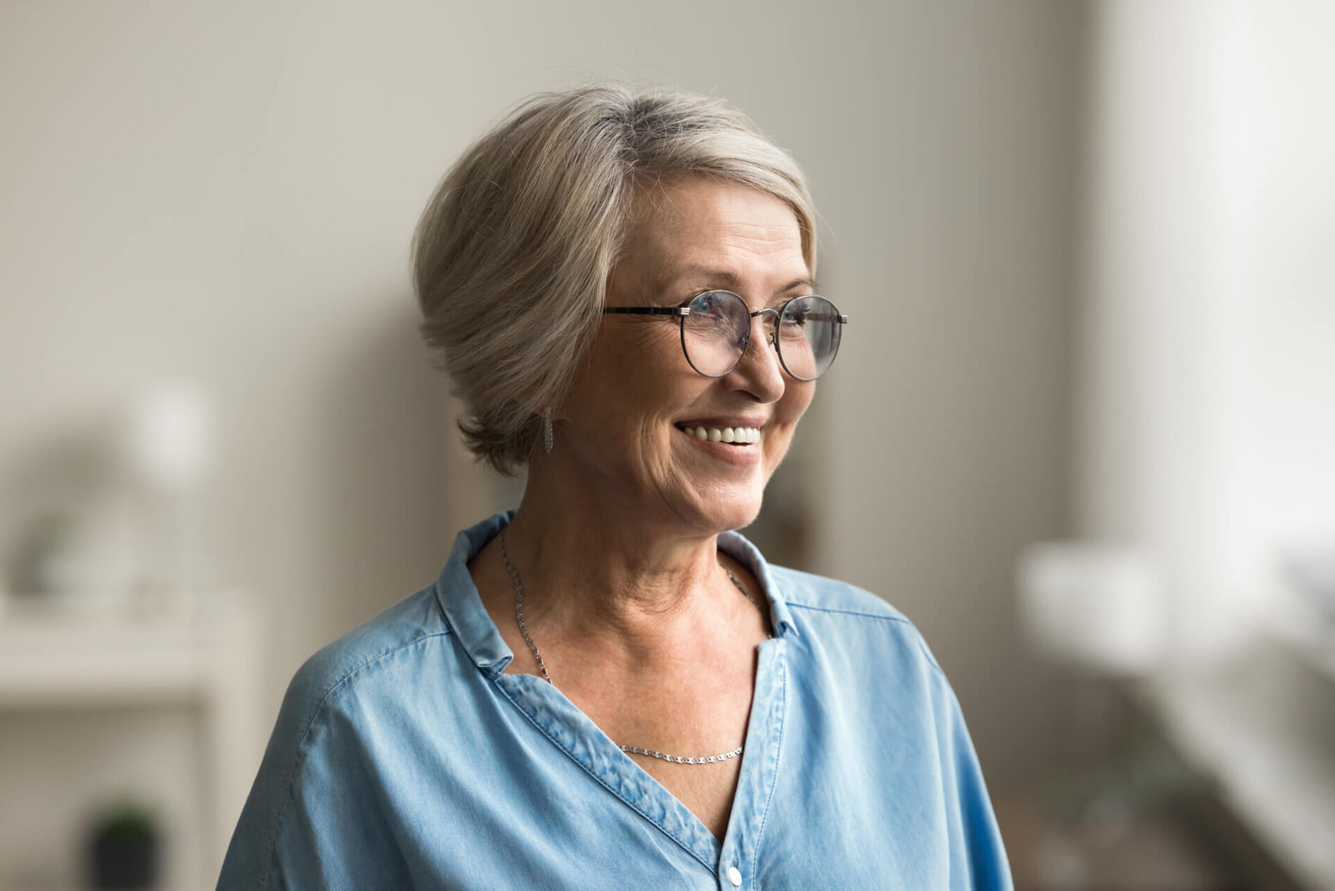 Patient smiling after her eye appointment with her local eye doctor