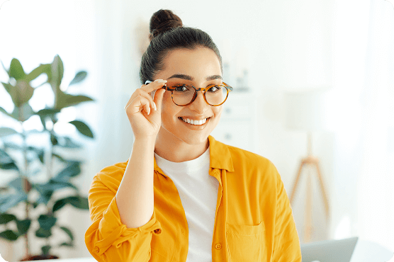 Patient smiling after her eye appointment with her local eye doctor