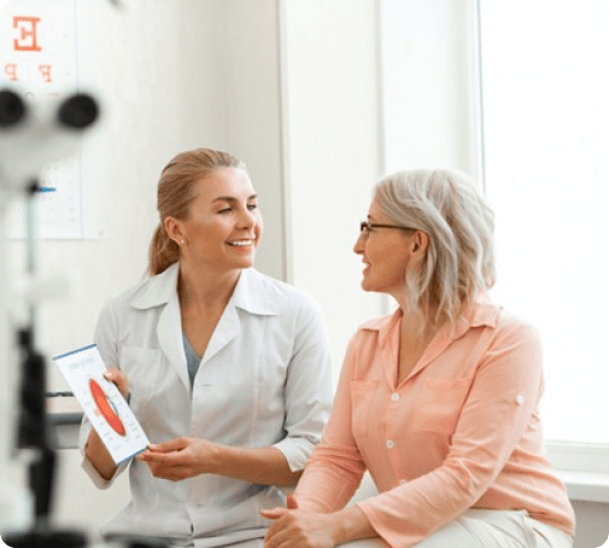 Eye doctor showing a patient an eye scan illustrating signs of glaucoma