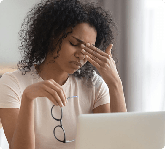 Patient smiling after her eye appointment with her local eye doctor
