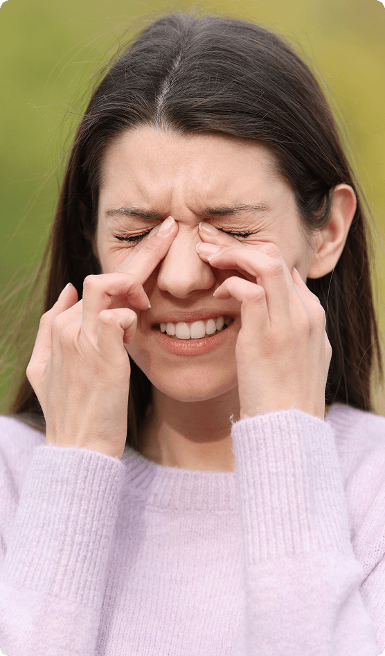 Patient smiling after her eye appointment with her local eye doctor